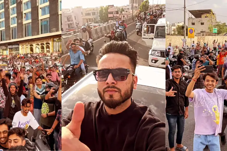 Elvish Yadav Bigg Boss OTT 2 fame showing thumbs-up to fans from car's open roof